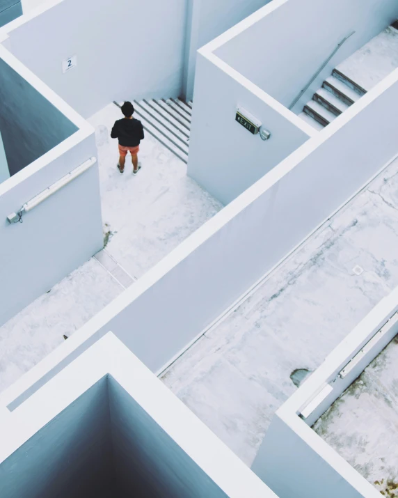 a person is standing in an odd looking building