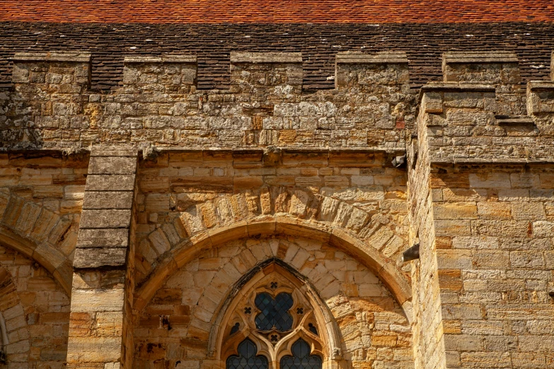 an old building with two very large windows