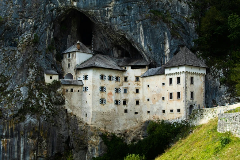 a small house built into the side of a mountain