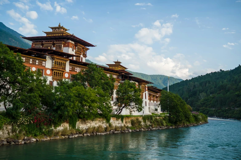 a row of buildings sitting on the side of a river