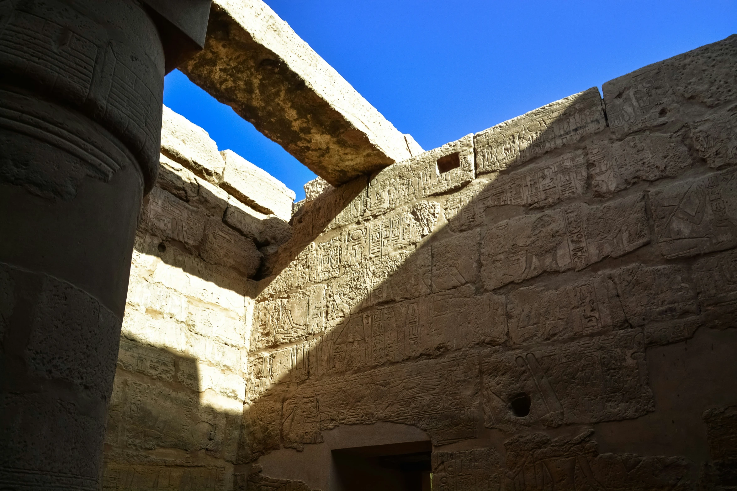 looking up at a doorway between two stone pillars