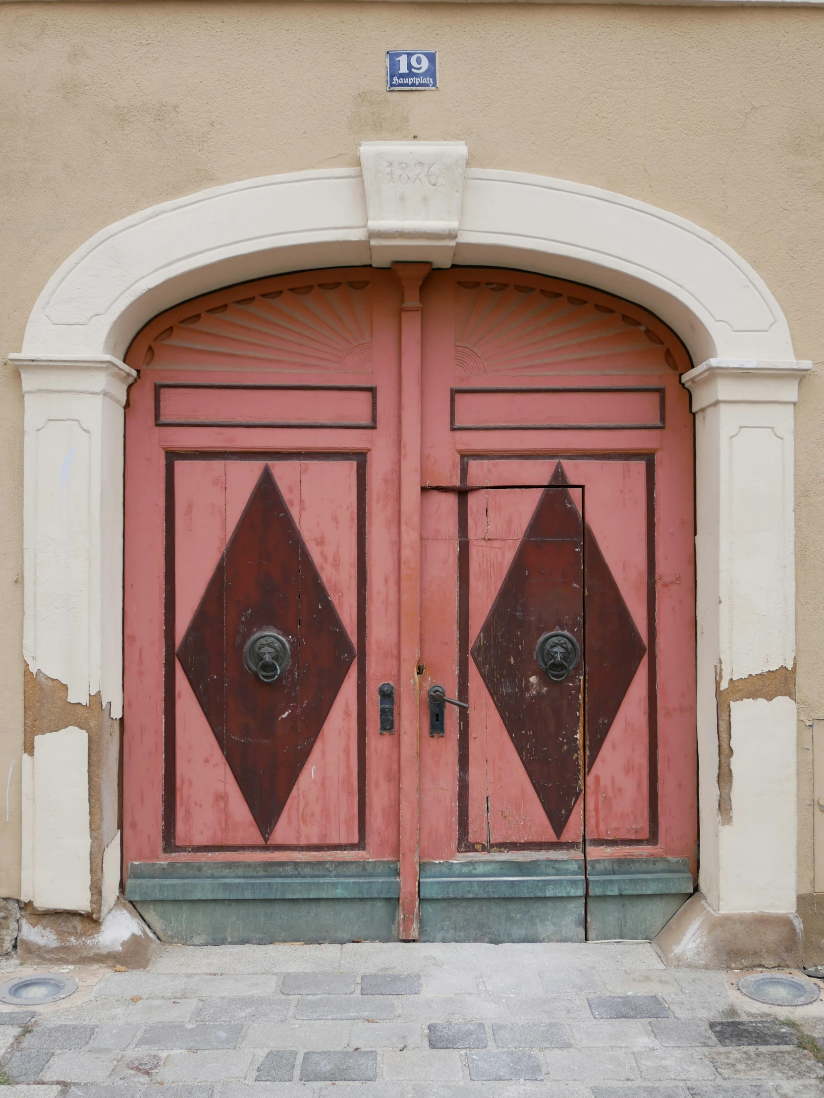 a big red door on the front of a building