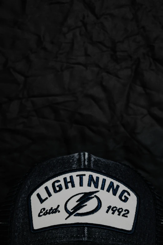 black cap with lightning and lightning sticker