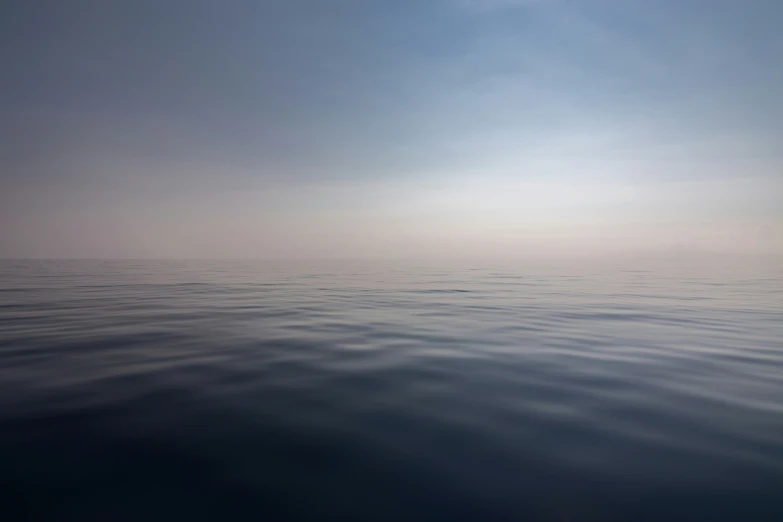 a long line of calm water on a bright day