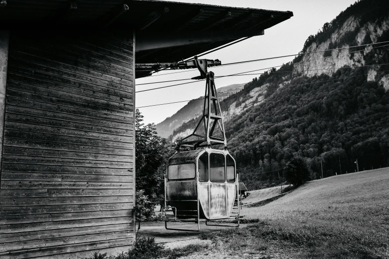 a black and white picture of a chair on a chair lift