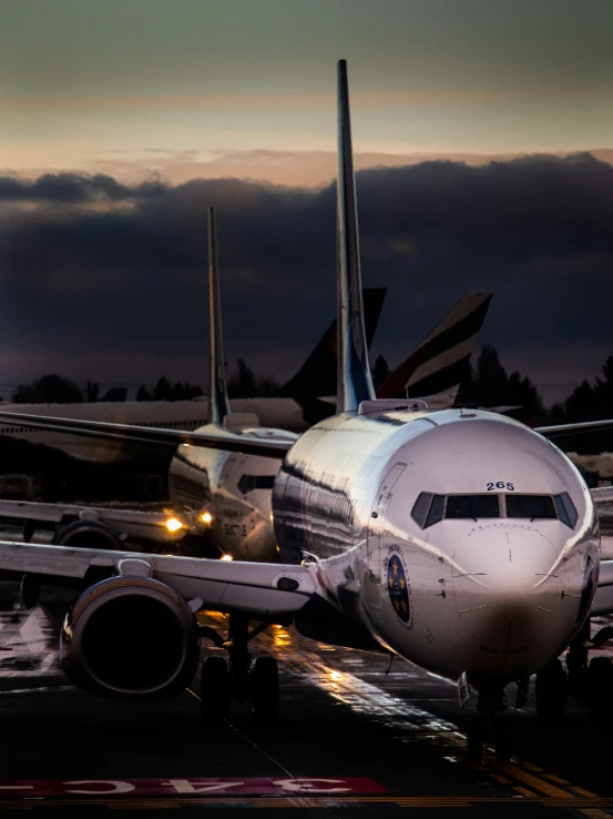 a large passenger jet sitting on top of an airport tarmac