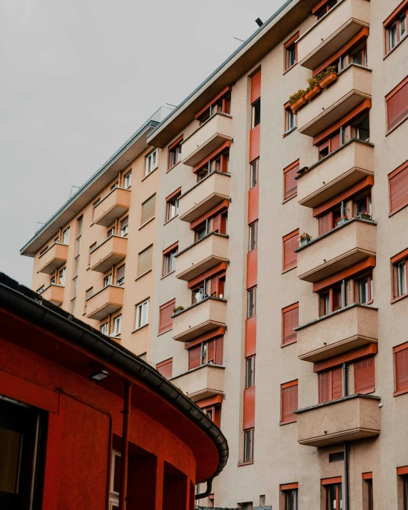 the facade of an apartment building with lots of windows