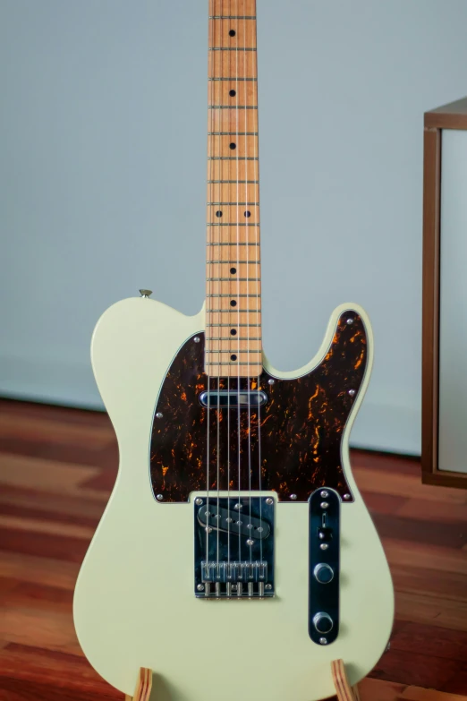 a guitar with an electric pick up for a tune