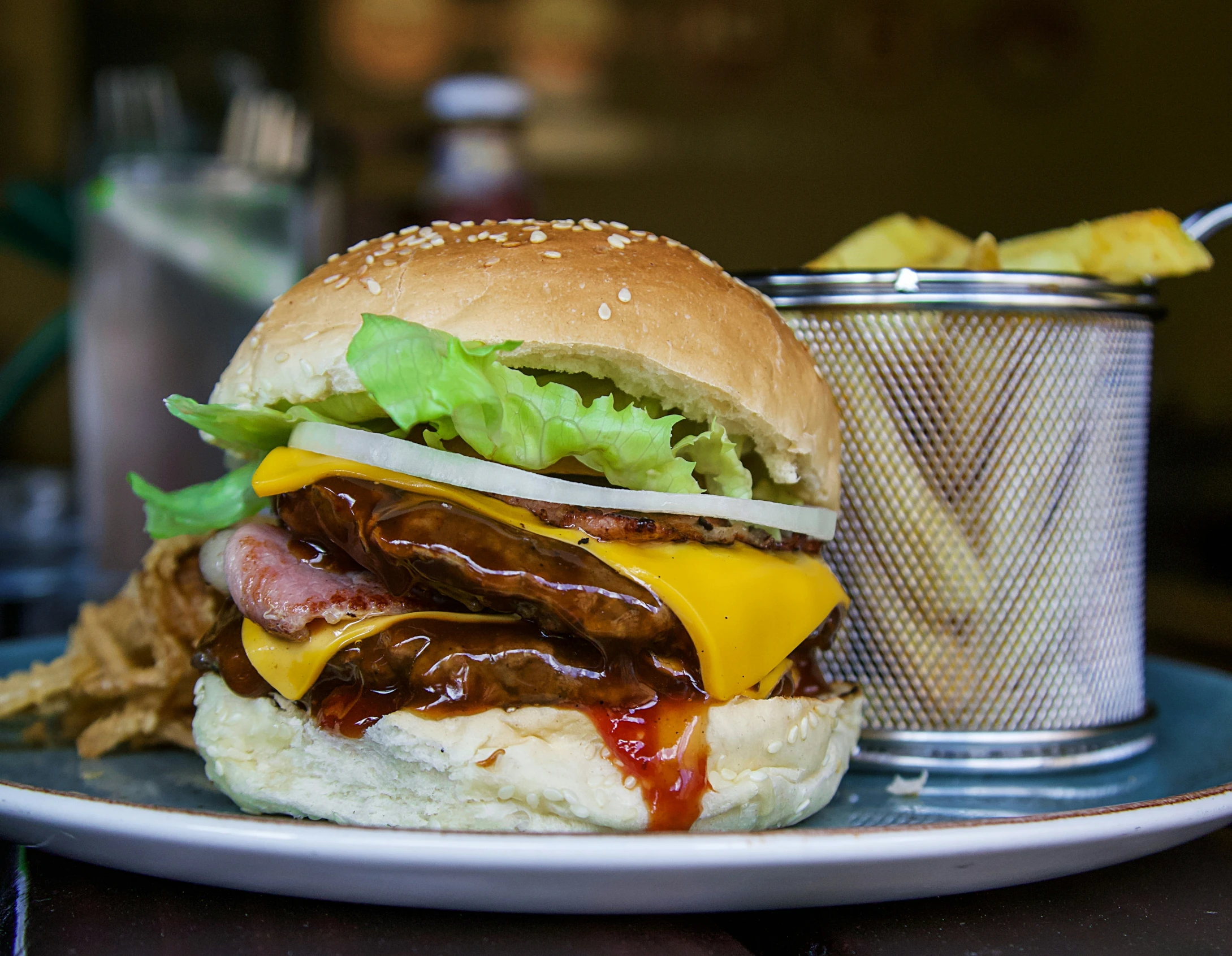 a very big burger with some sort of condiment