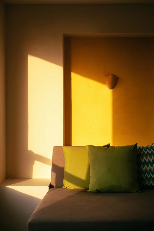 sunlight streaming through the windows onto a couch