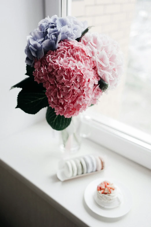 a white table sitting next to a window