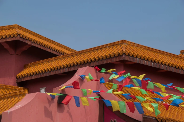 colorful flags on the roof of a building