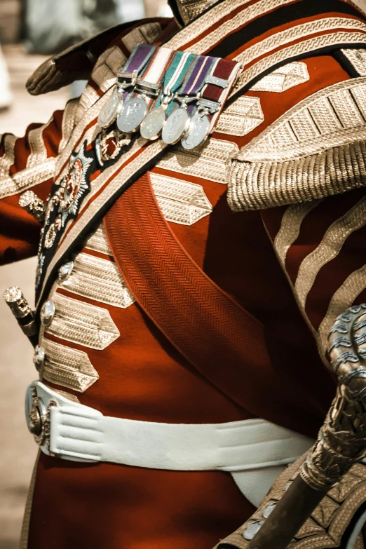 closeup of a colorful jacket and a sword