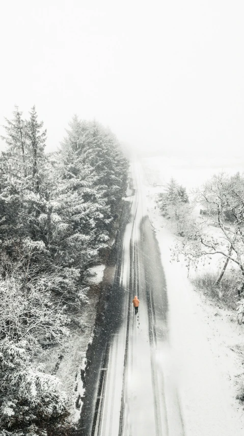 a road with a train and cars on it