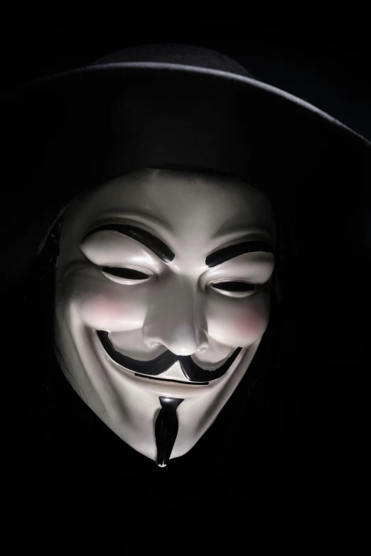 the guy fawkett mask was dressed up in black