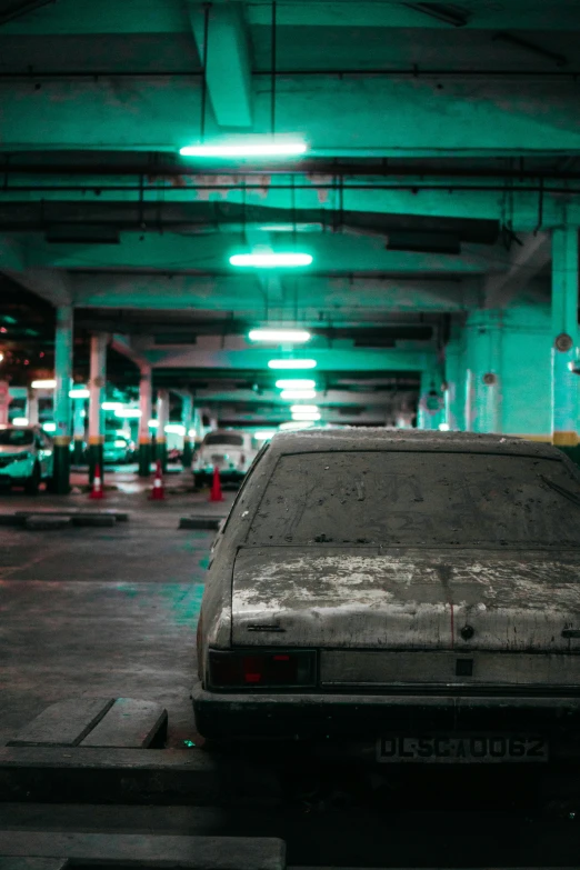a large parked car in an underground parking garage