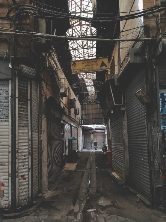 a narrow alley with lots of storage spaces