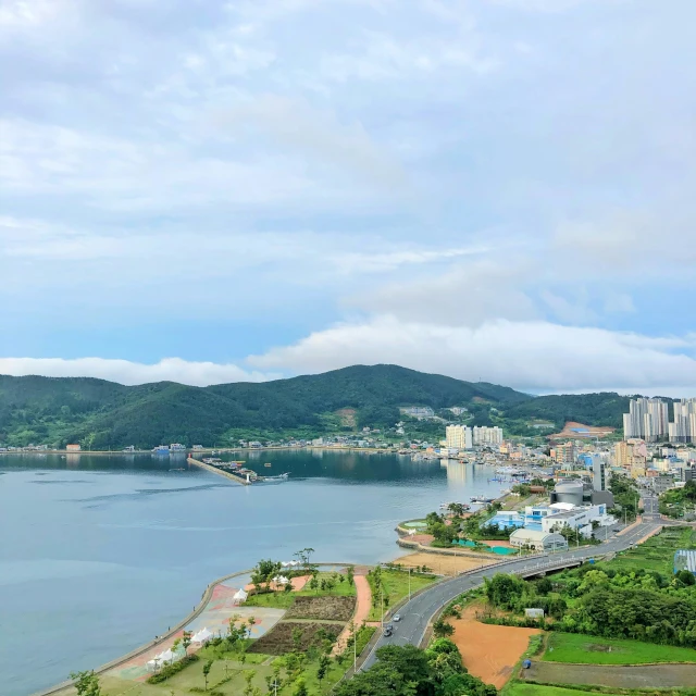 an aerial view of a city by the water