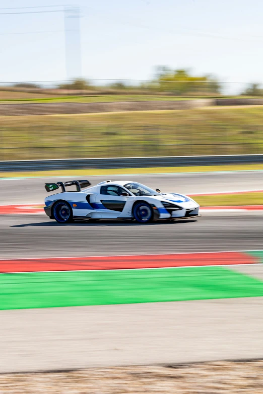 a racing car is driving down a race track