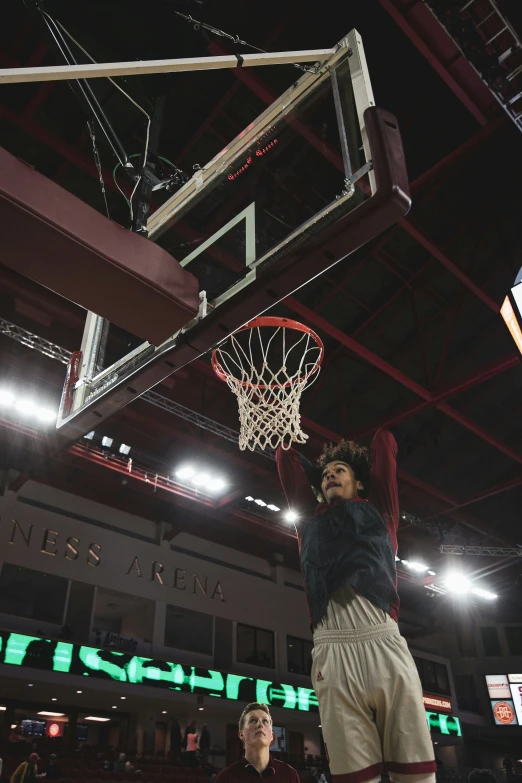 the young basketball player is going to dunk