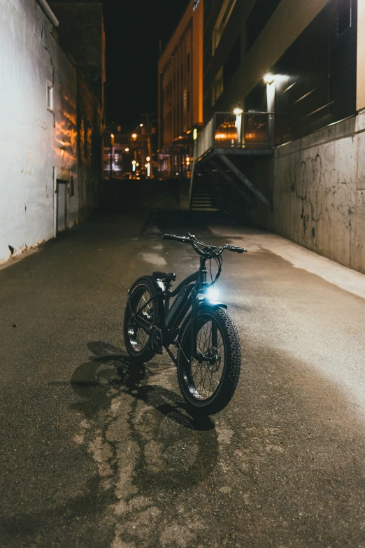 bike parked in the middle of an empty street