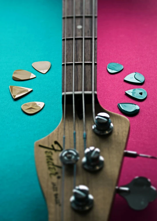 an acoustic guitar with several metal pieces on it