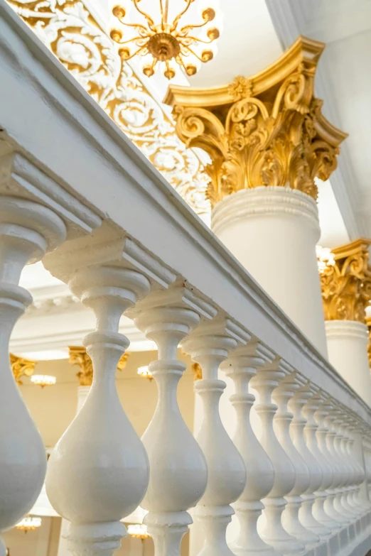 a close up image of a railing that is painted white