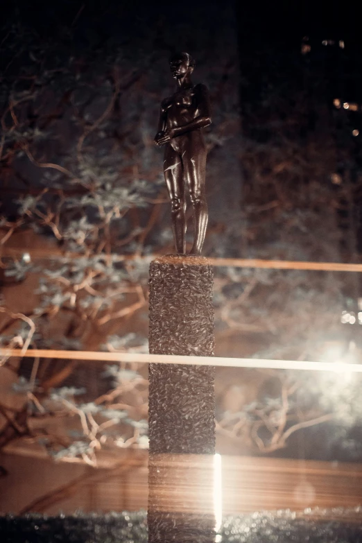 an abstract po of a statue in a snowy forest