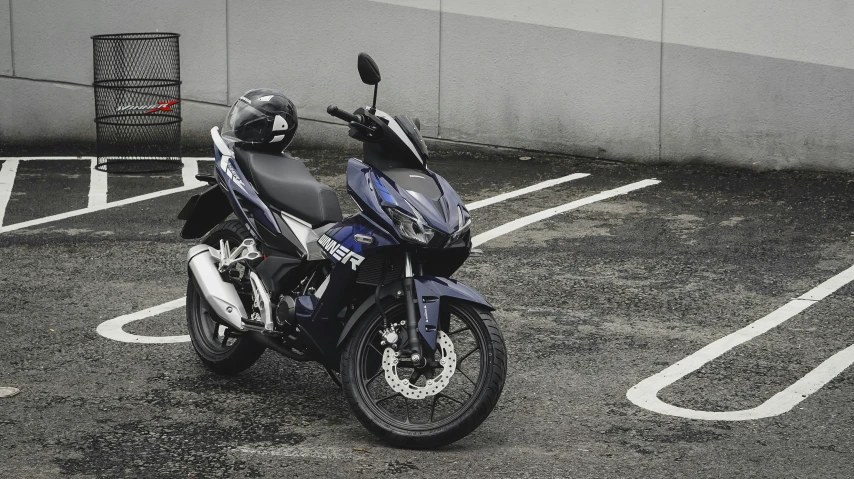 a blue motorcycle parked in a parking lot