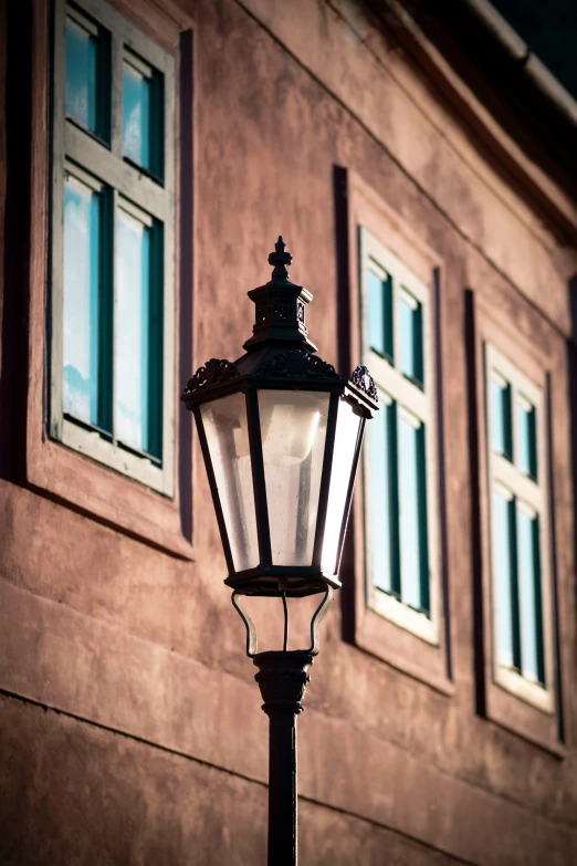 an old fashioned lantern on a street corner