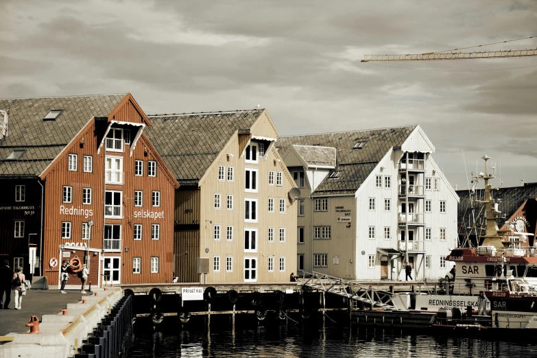 a group of small houses near the water