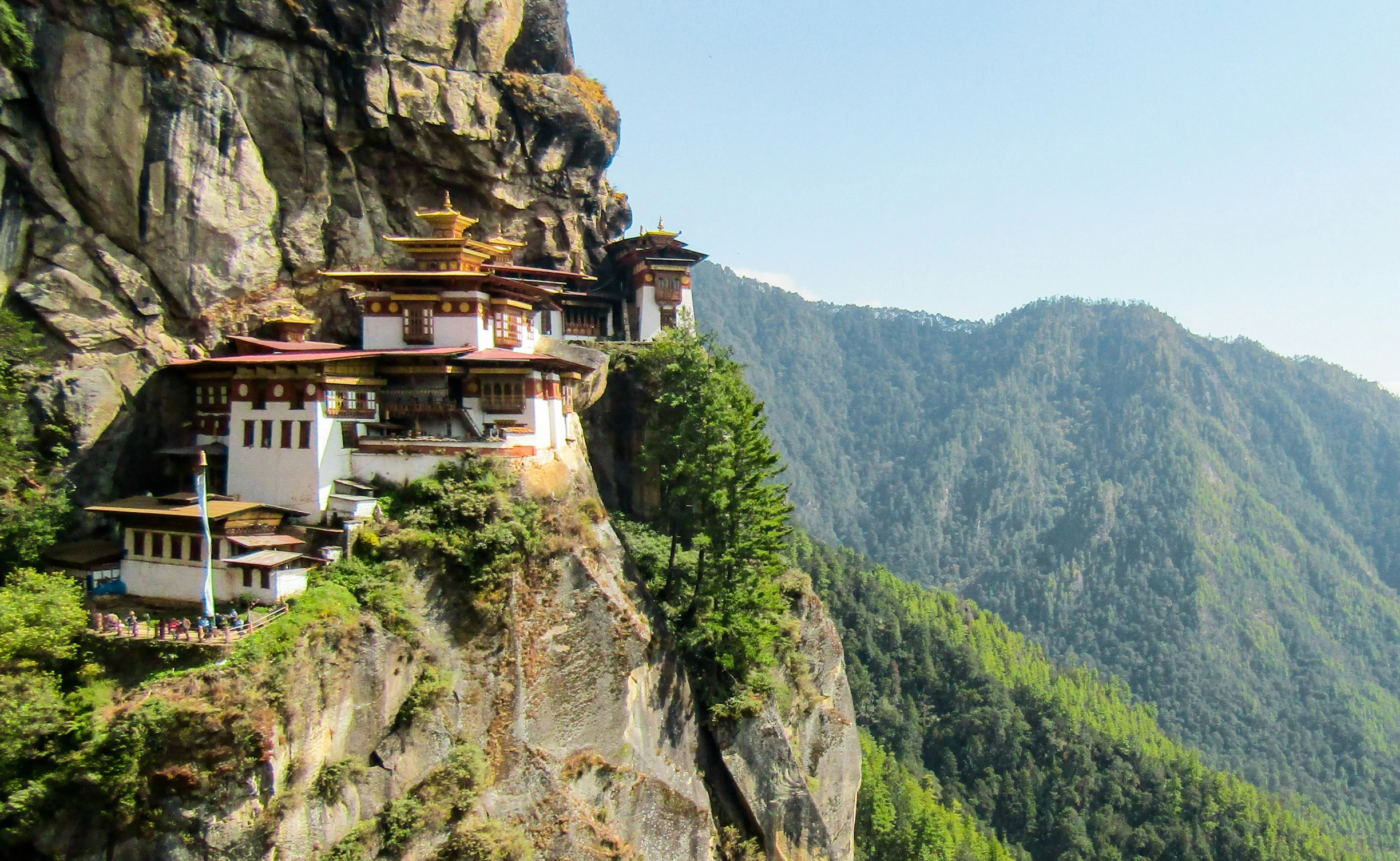 buddhist monastery perched on top of the cliff on a clear day