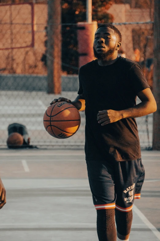 young basketball player dribbling on the court while playing