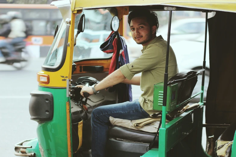 a man that is sitting inside of a truck