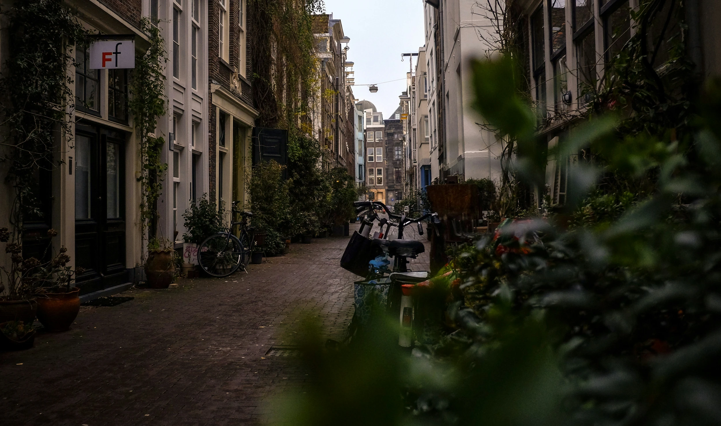 an alley in a european city with old buildings