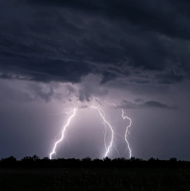 a large group of lightning bolts, captured from the ground