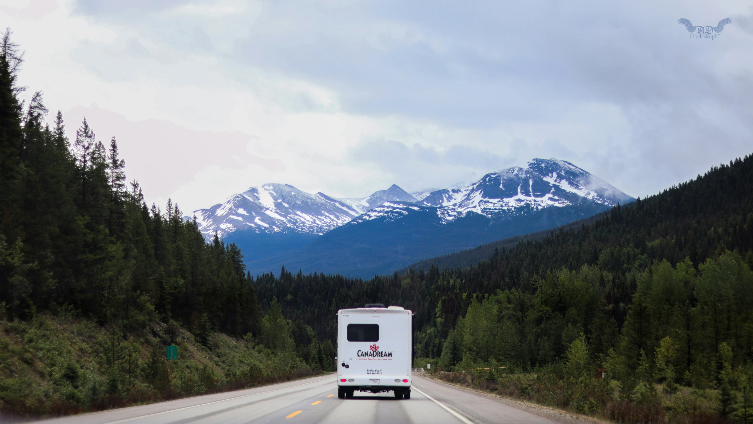 truck and bus driving in a mountainous mountain scene