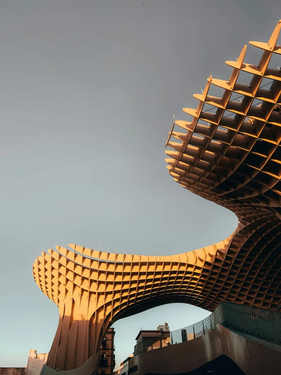 several sculptures stand in front of a blue sky