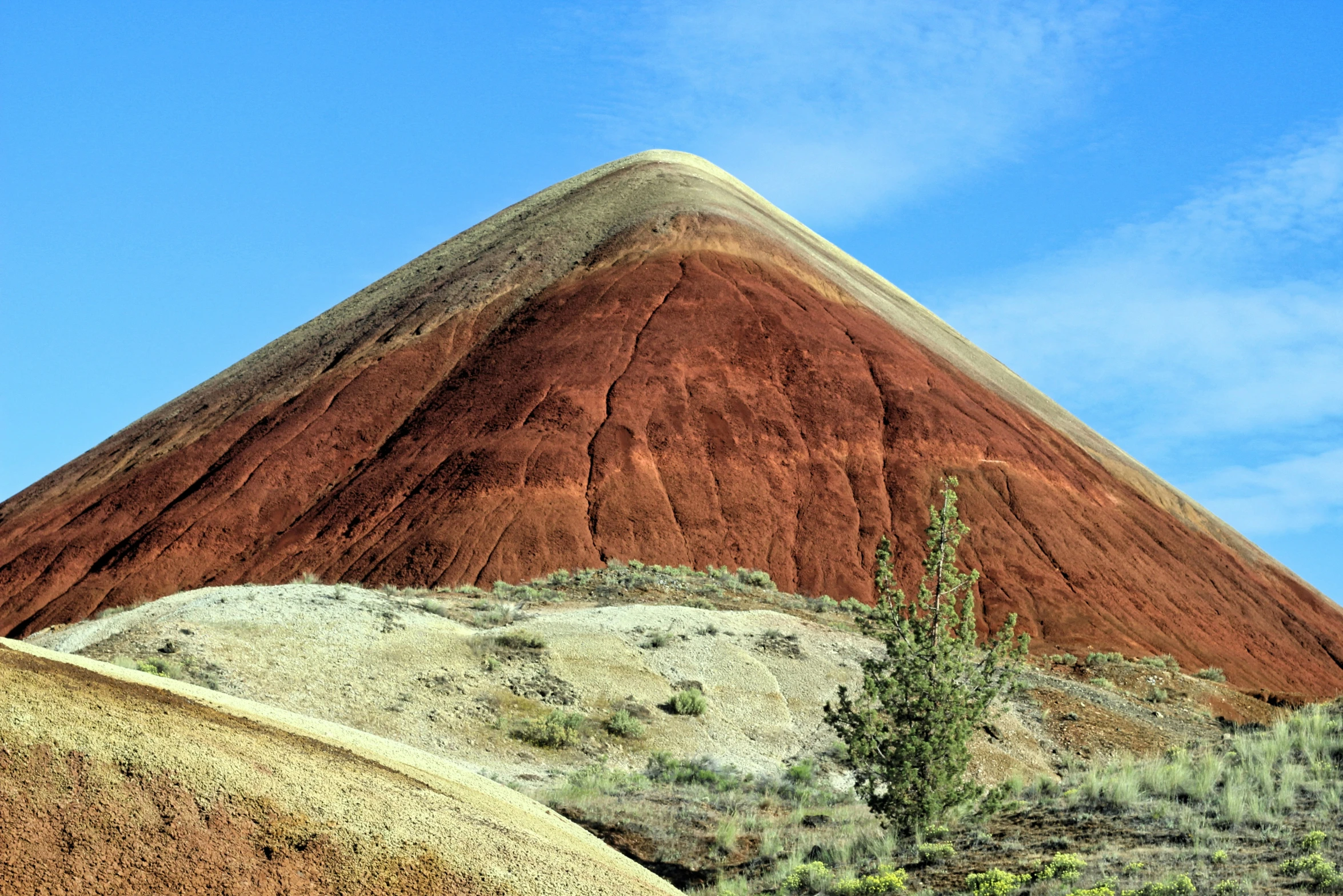 a big steep mountain next to the desert