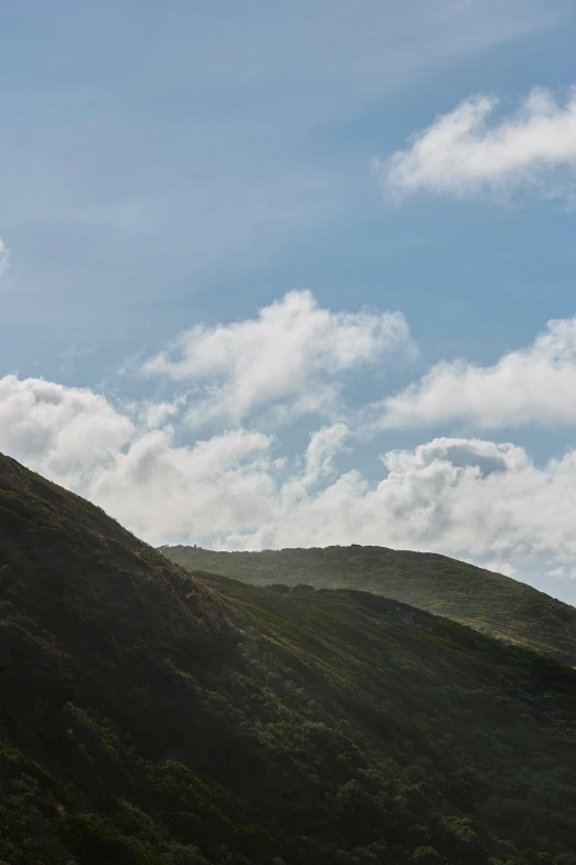 the distant po of a large hillside on a sunny day