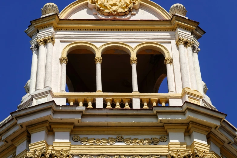 a view of a clock and top of a building