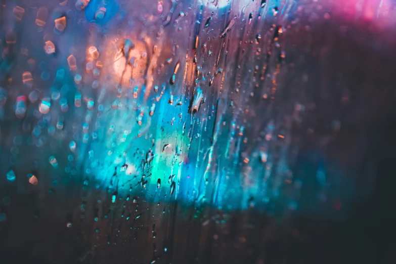 blurred image of rain pouring on the glass