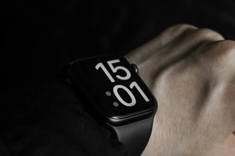 the black smart watch with a white watch face