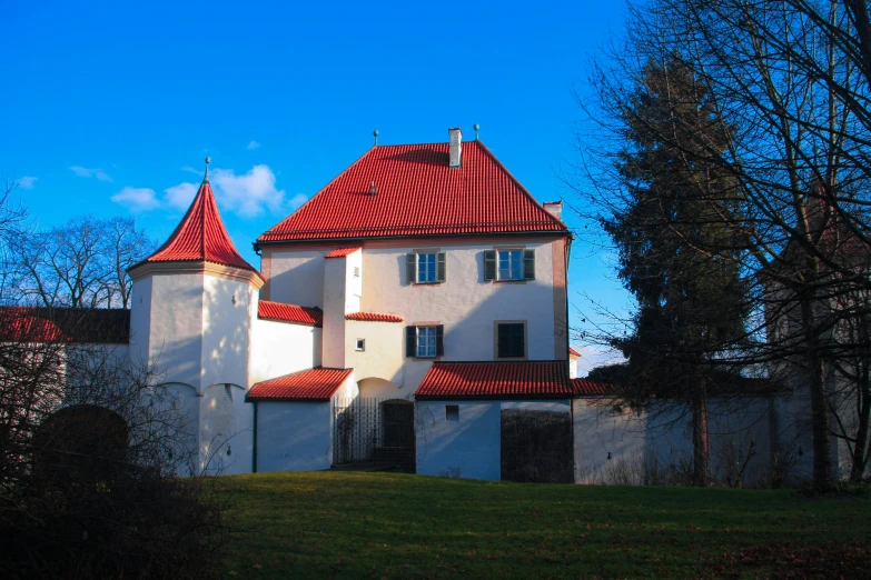 a big white house with a red roof