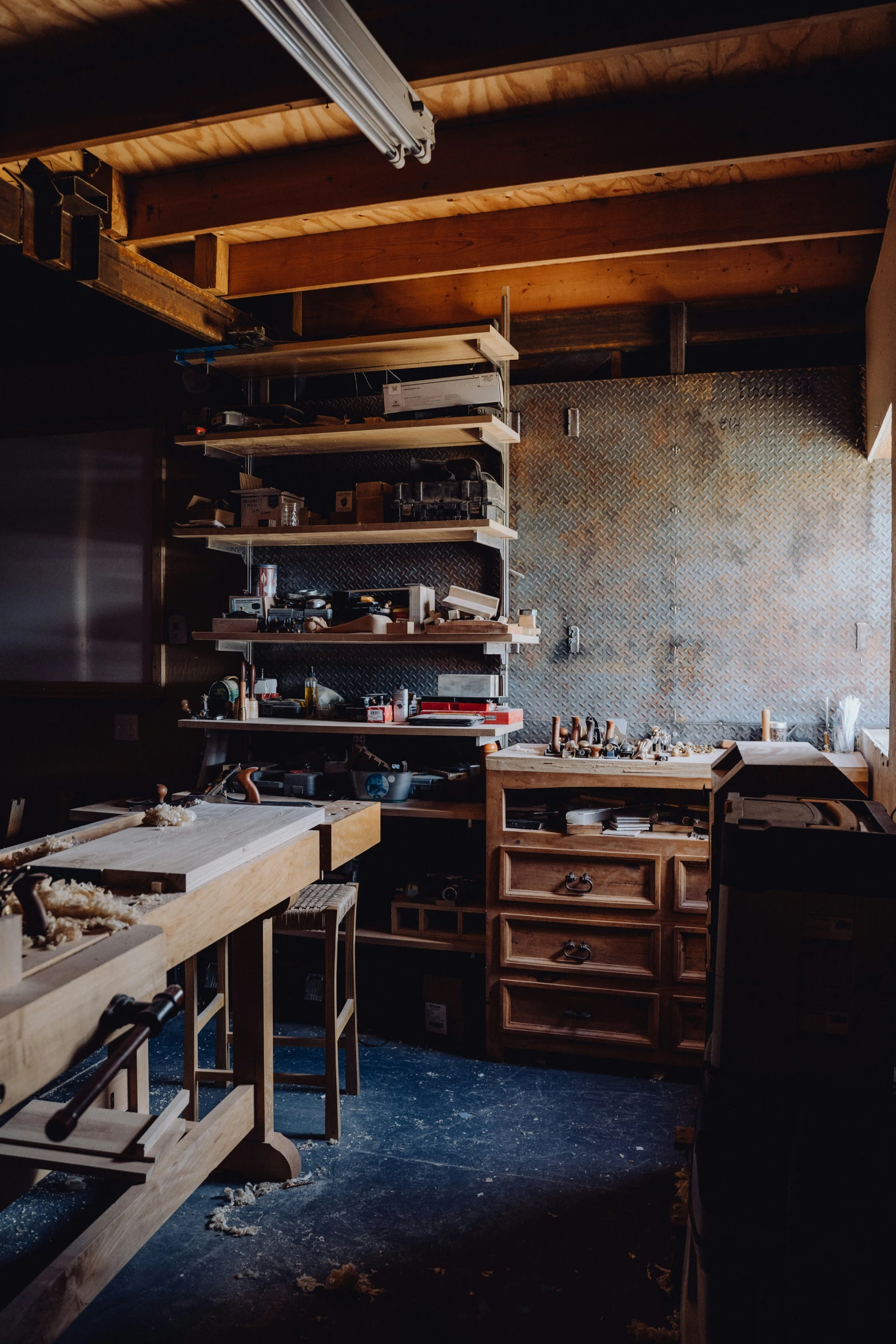 a room full of various wood work work benches and shelves