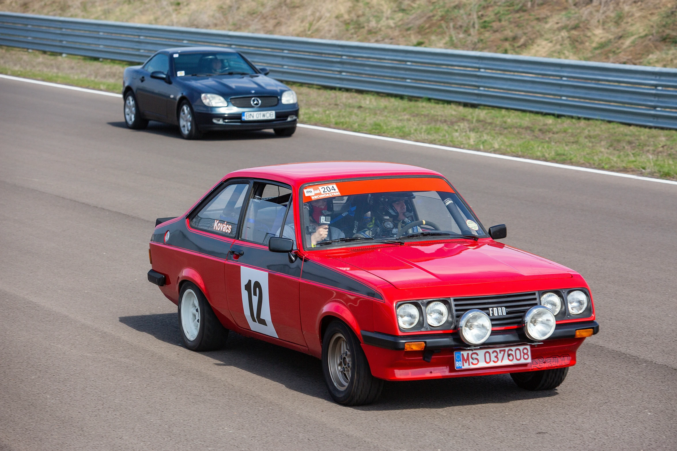 a race car drives along a race track