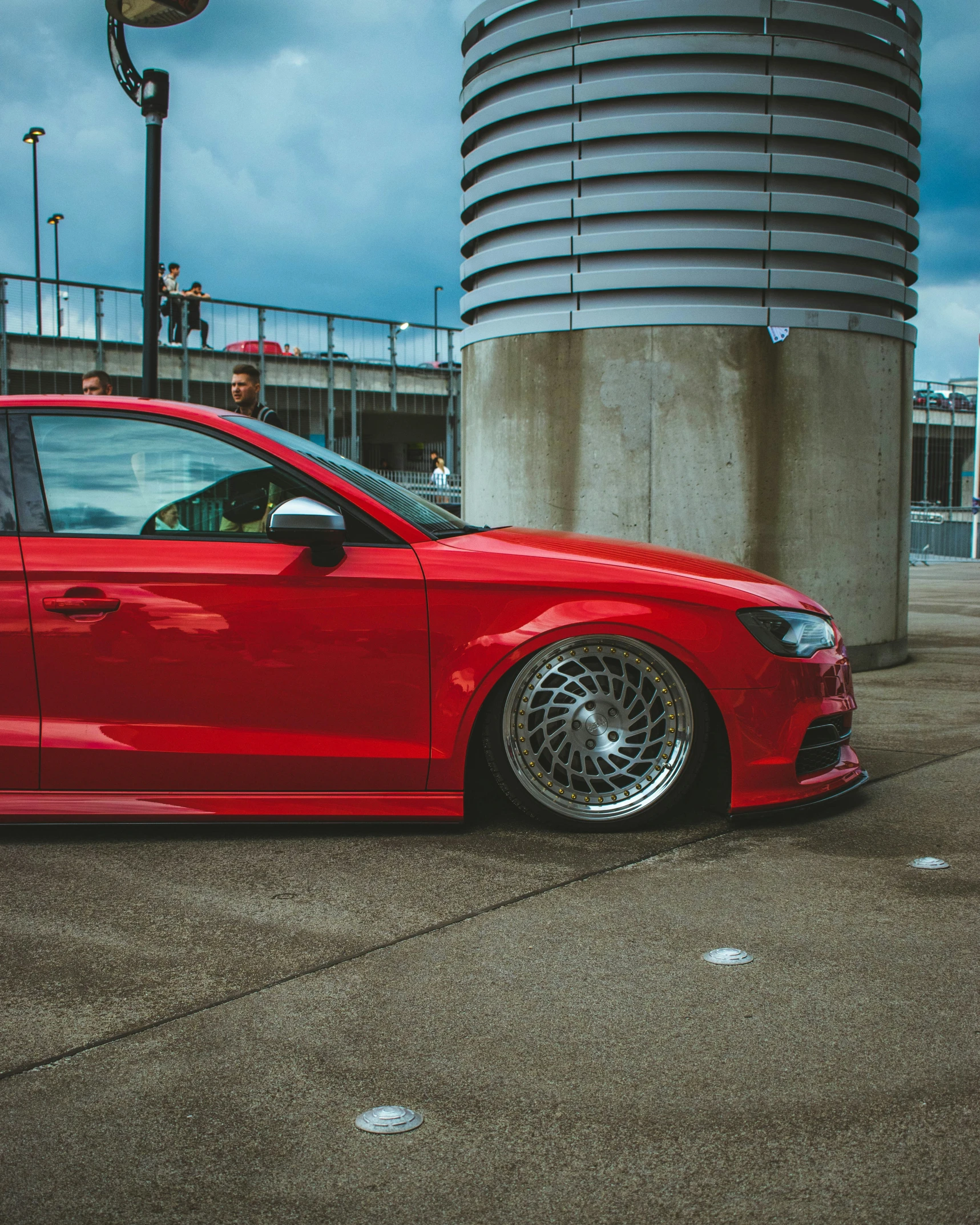 the red car is parked outside by some building