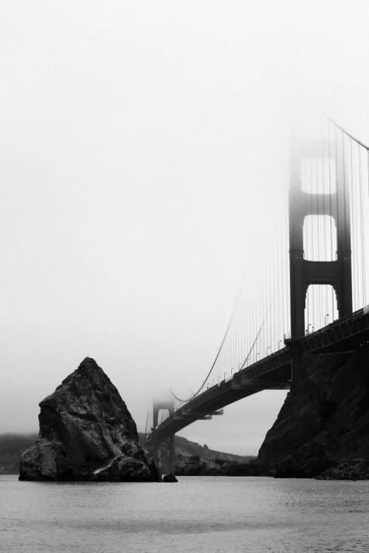 a very tall bridge in the middle of the water