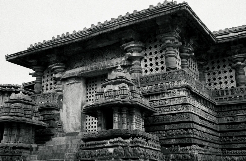 some carved stone building with pillars and windows