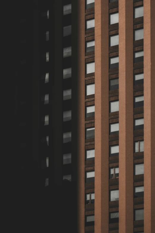 the side of an apartment building with multiple windows